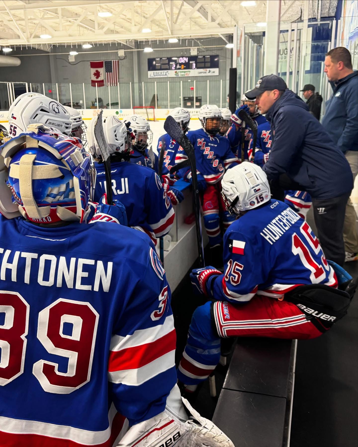 Coach Jarno Karttunen with a team on the bench